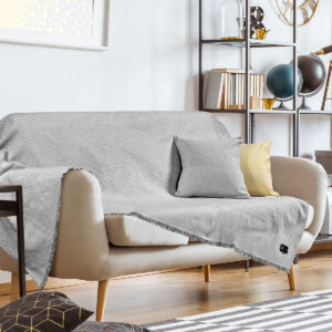 Painting,On,White,Wall,Above,Sofa,With,Cushions,In,Living