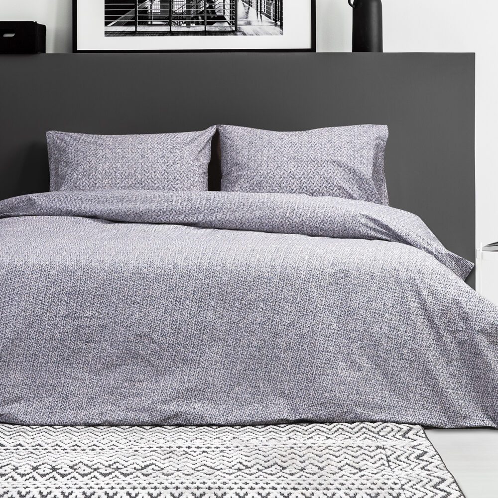 Poster,On,Black,Bedhead,Of,White,Bed,In,Contrast,Bedroom